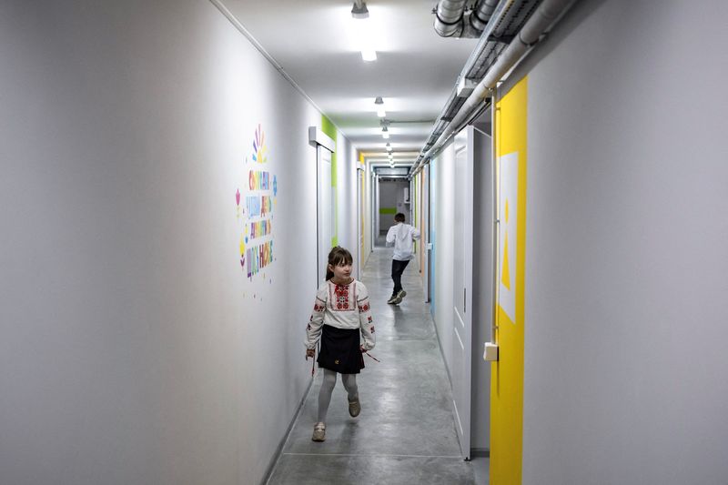 Ukrainian children open school year by heading underground