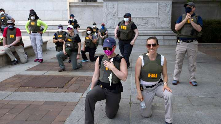 FBI agents shown kneeling during 2020 protests are fired : NPR