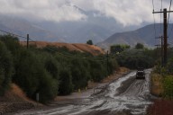 Mudslides trap drivers, bury roads and damage homes in Southern California