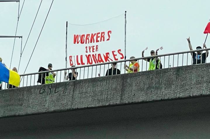Anti-Trump protests line overpasses in Kent, Auburn, Covington