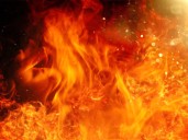 Firefighters respond to a car fire that later engulfs a house in Lowndes Co.