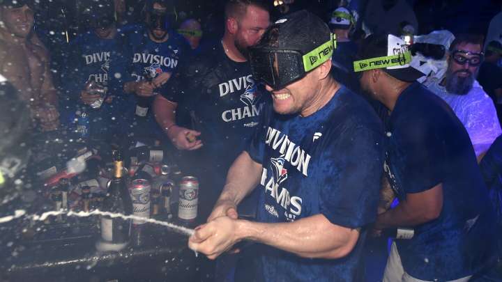 Blue Jays cap turnaround from worst to first by holding off Yankees to win seventh AL East crown