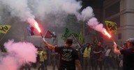 Strikes and protests roil France, pitting the streets against Macron and his new prime minister
