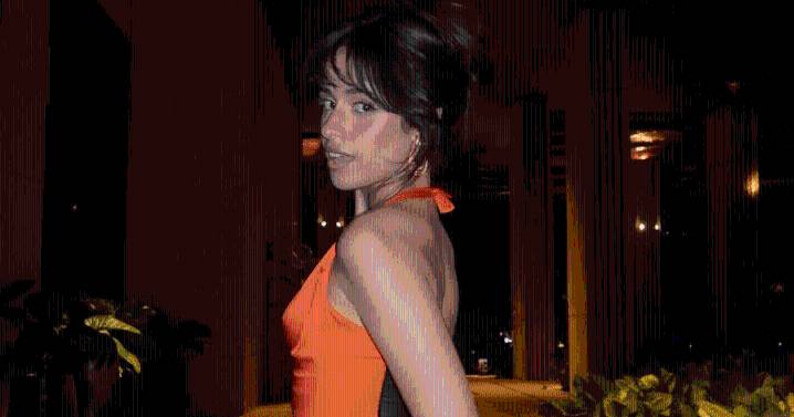 Camila Cabello Adds Splash of Fun in Vibrant Orange Minidress in Photos