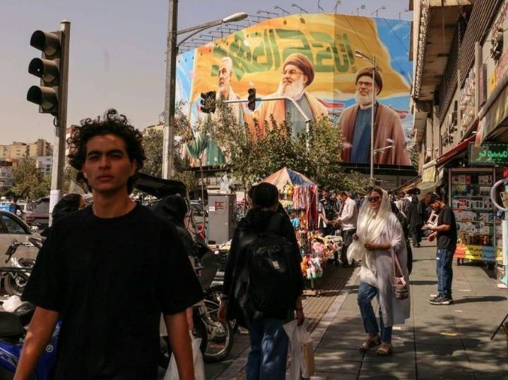 'WE'LL BE RUINED': Iranians feel strain as sanctions snap back