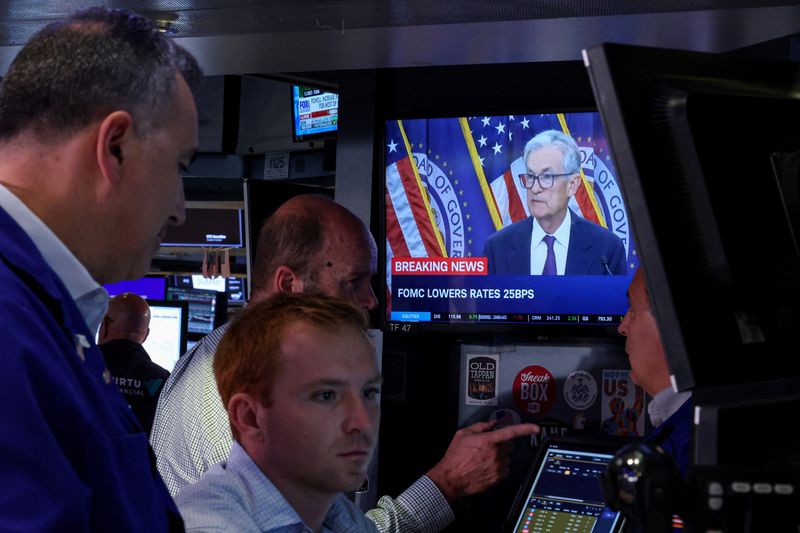 Analysis-Fed's rate cut comes with caveats, leaving investors lukewarm