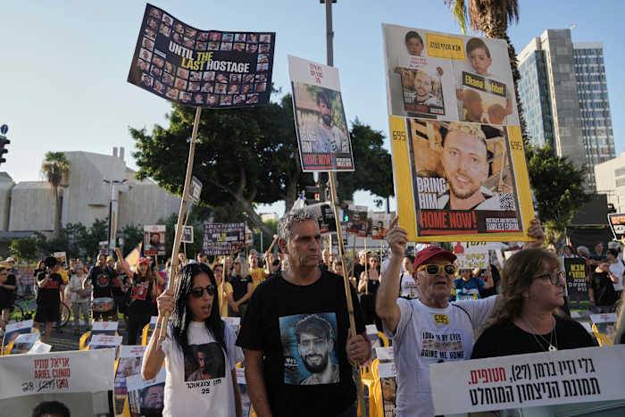 Strikes across Gaza kill at least 31 as international scholars accuse Israel of genocide