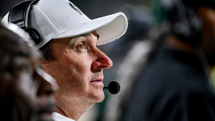 Michigan State football coach Jonathan Smith through the years