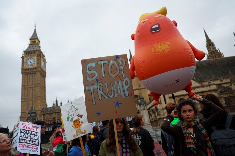 Anti-Trump protesters march through London as president basks in royal welcome