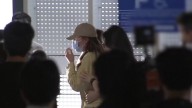 See the moment detained South Korean workers return home
