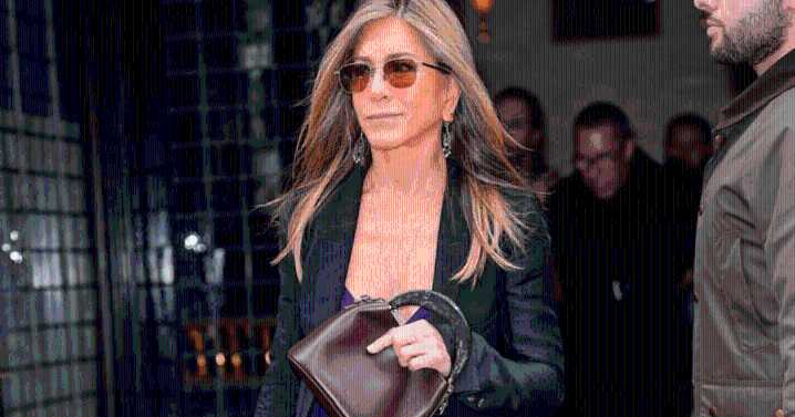 Jennifer Aniston Ditches All-Black for Color in Purple Dress for NYC Outing