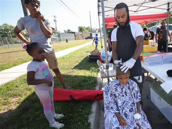 Photo Gallery: Sneaker and backpack giveaway at Nelson Grace Park