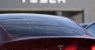 Tesla under investigation after parents say faulty door handles trapped their kids in the back