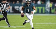 Defending champion Eagles edge Cowboys 24-20 in wild, lightning
