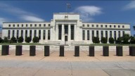 Federal Reserve cuts key rate by quarter-point and signals two more cuts this year