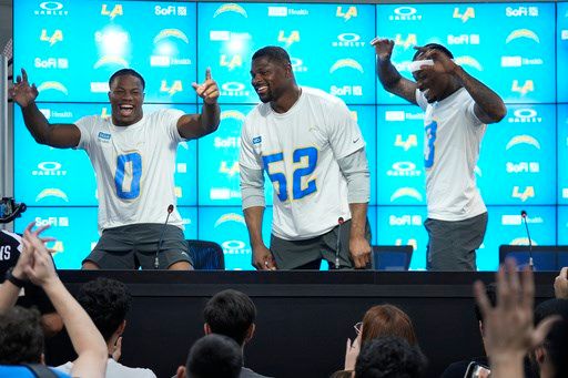 Chargers coach Jim Harbaugh say he's excited about the opportunity to play on 'a world stage'