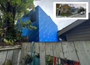 Tiny homes dwarfed by city hall-approved backyard ‘Goliath’