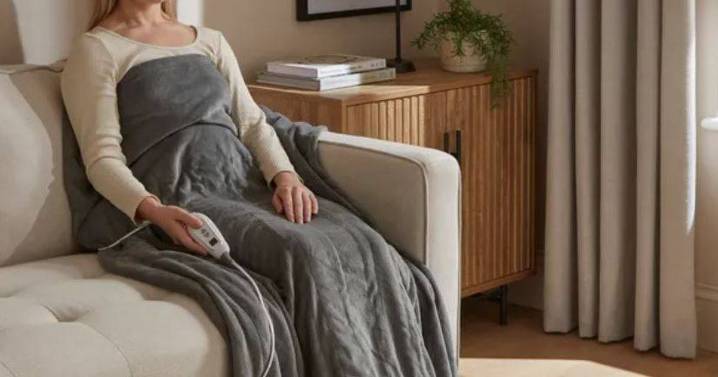 Dunelm's 'wonderful' £32 heated throw is a 'good alternative’ to central heating