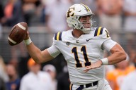 Ex-Michigan QB cracks 5,000 career passing yards but throws 2 picks in loss