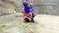 A US-funded nutrition program was helping to keep this woman’s baby alive. Days after the program was cut, he died