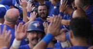 Kirk drives in six runs as Jays wallop Rays 13-4 to win division and earn playoff bye