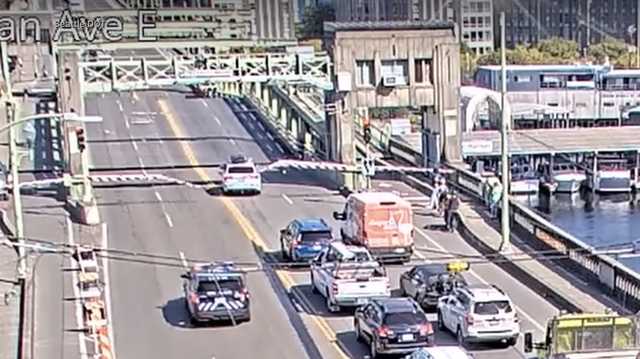 Suspect's car jumps gap of open drawbridge during high