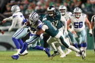 Eagles open title defense with tight win over Cowboys