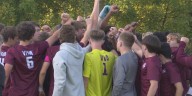 Okemos boys soccer united as one family under the tradition of Viva Maroon