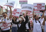 Dozens arrested and hurt in clashes with police near Philippine presidential palace