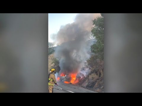 Car fire sparks Hollywood Hills brusher