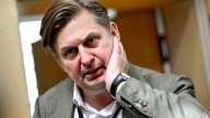 German parliament lifts immunity of a prominent far-right lawmaker and police search his home