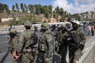 Palestinian gunmen kill six in Jerusalem bus stop shooting