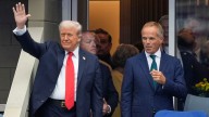 Cheers and boos as Donald Trump arrives for delayed Sinner
