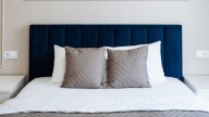 Is Your Bed Between Windows? You Need To Consider This About Your Headboard