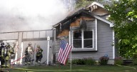 Garage destroyed, home badly damaged in Hermon fire