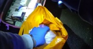 Woman, 45, arrested on busy south Manchester road with suitcase filled with over 3,500 tablets