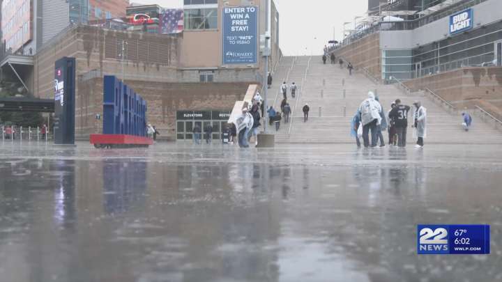 Patriots fans brave weather to support team in season opener