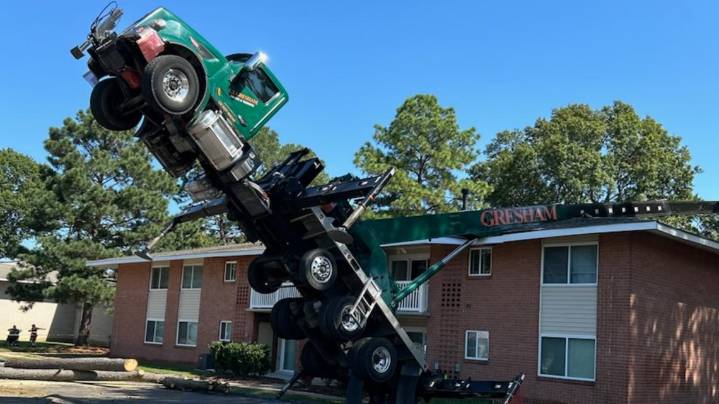 Crane tips onto Virginia Beach apartments, no injuries