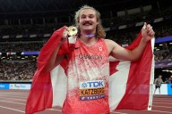 Ethan Katzberg claims third world hammer title with record
