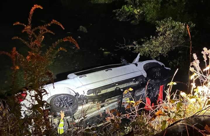 Man, 2 dogs injured after truck crashes, lands in river in East Bridgewater