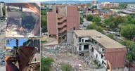 Debris falls on construction vehicle as demolition work continues on former Denver7 building at 123 Speer