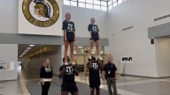 From the huddle to the pyramid: NHHS seniors break barriers in cheer and football