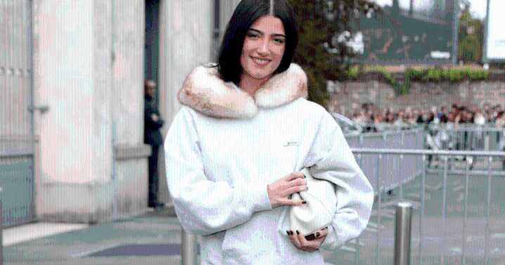 Charli D’Amelio Wears a Neck Pillow Resembling Fur Collar in Milan Photos