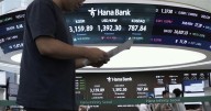 Asian shares are mixed and gold sets a fresh record high of over $3,550 per ounce