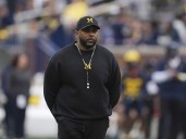 Michigan coach Sherrone Moore says Biff Poggi will lead team during his upcoming 2