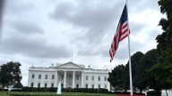American flags stand at half-mast in honor of conservative leader Charlie Kirk