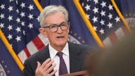 Powell signals Fed will move slowly on interest rate cuts