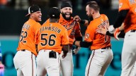 Orioles one out from being no-hit, score 4 runs to stun Dodgers