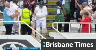 Woakes walks out in a sling