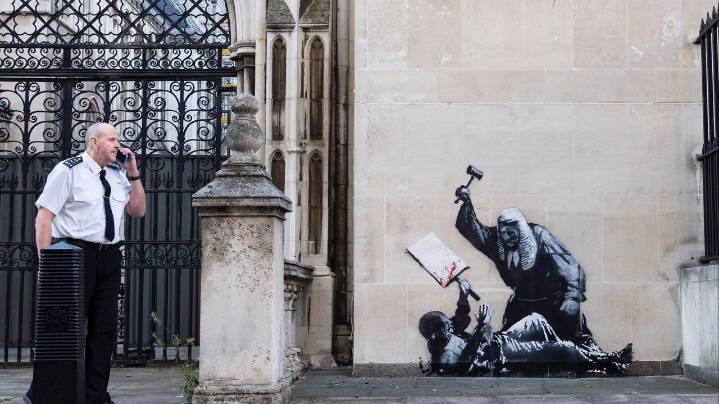 New Banksy mural of a judge beating a protester to be removed from outside London court